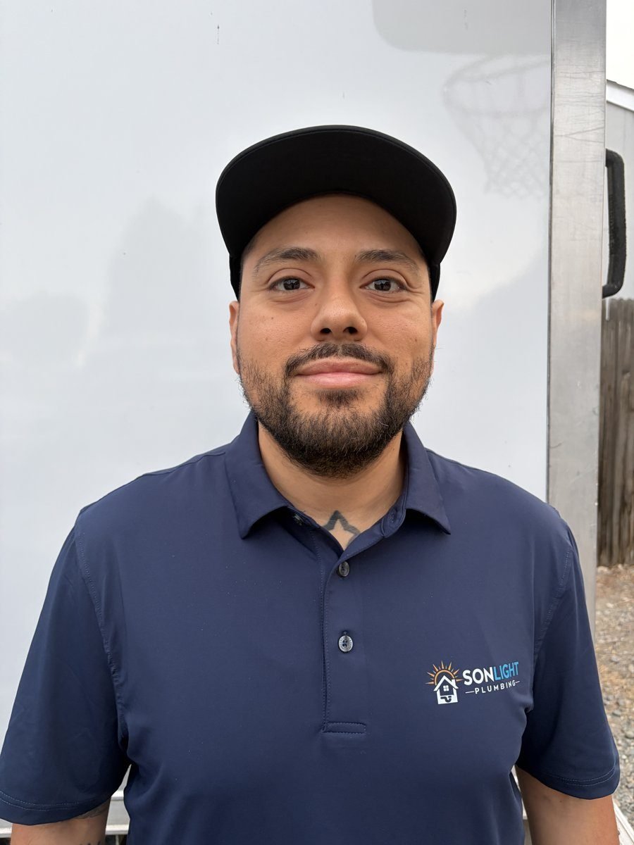 Jose Hernandez, owner of Sonlight Plumbing, in a Sonlight Plumbing polo shirt